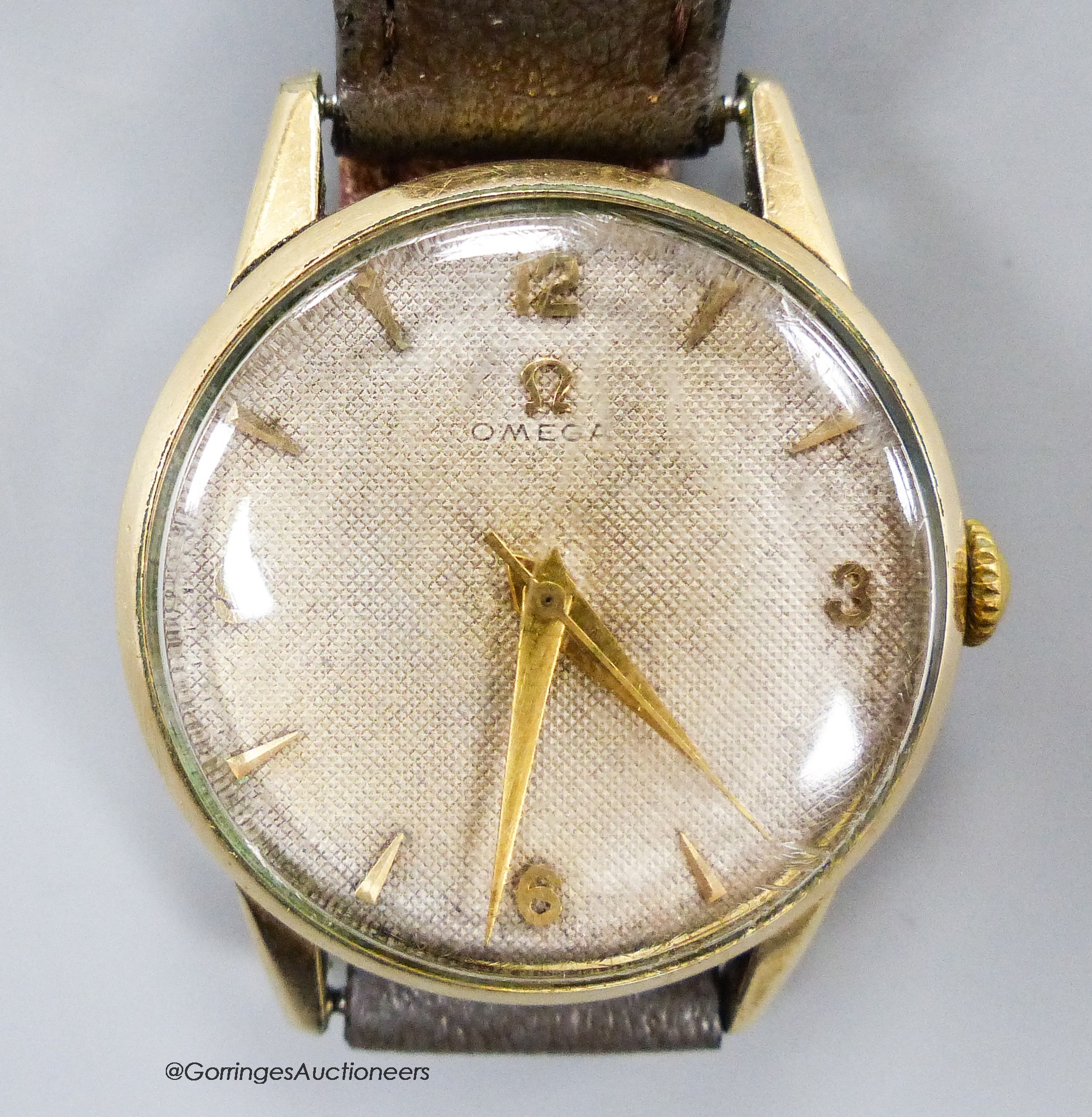 A gentleman's early 1950's gold plated Omega manual wind wrist watch, movement c.283, on associated strap.